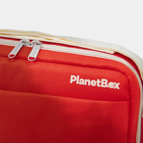 Red cooler bag with 'PlanetBox' logo on a white background