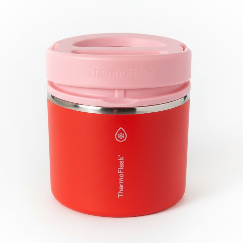 Red thermos with pink lid on a white background

